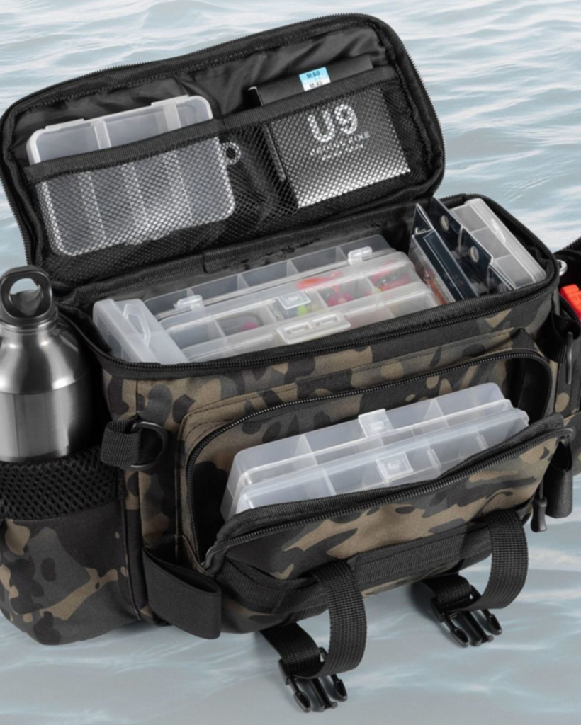 Top view of opened Nice Bags fishing tackle bag packed with organized lure boxes