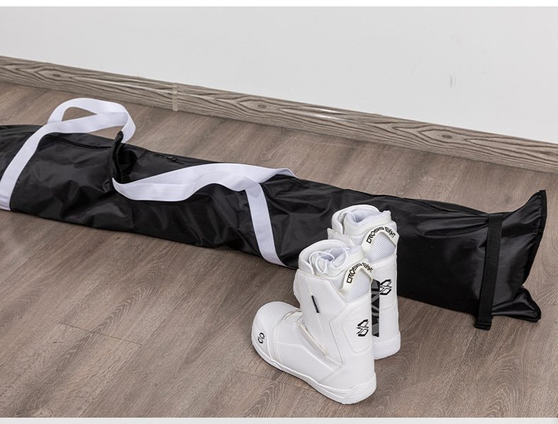 Nice Bags black ski bag displayed alongside white ski boots on floor