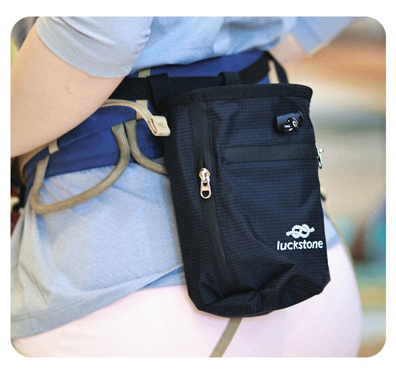 Close-up of climber wearing Nice Bags black rock climbing chalk pouch around waist