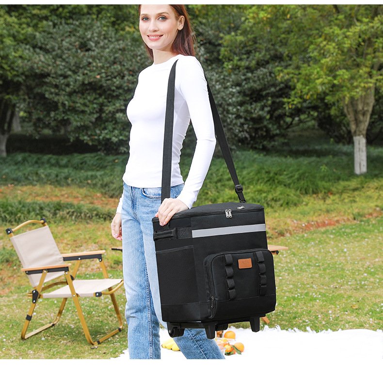 Woman carrying cooler bag crossbody style outdoors