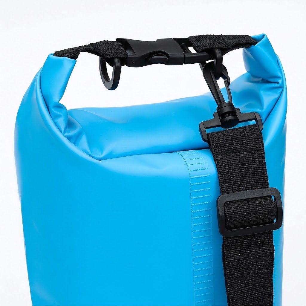 Close-up of a custom dry bag roll-top closure, buckle clip, and shoulder strap hardware