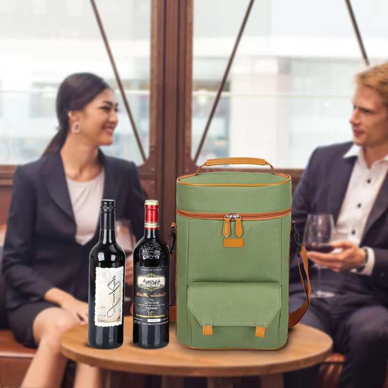 bag on table beside two wine bottles with two people seated