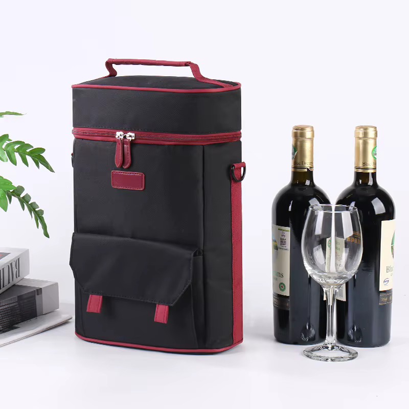 black red-piped bag angled view beside wine bottles and glass