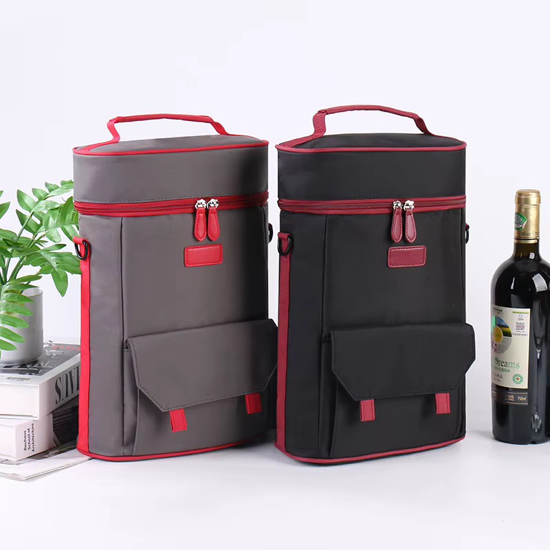 gray and black red-piped bags shown side by side