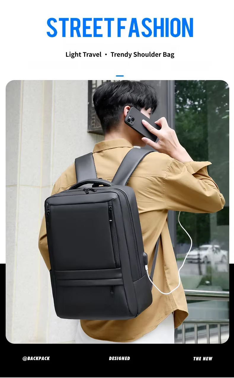 man wearing black backpack on one shoulder outdoors