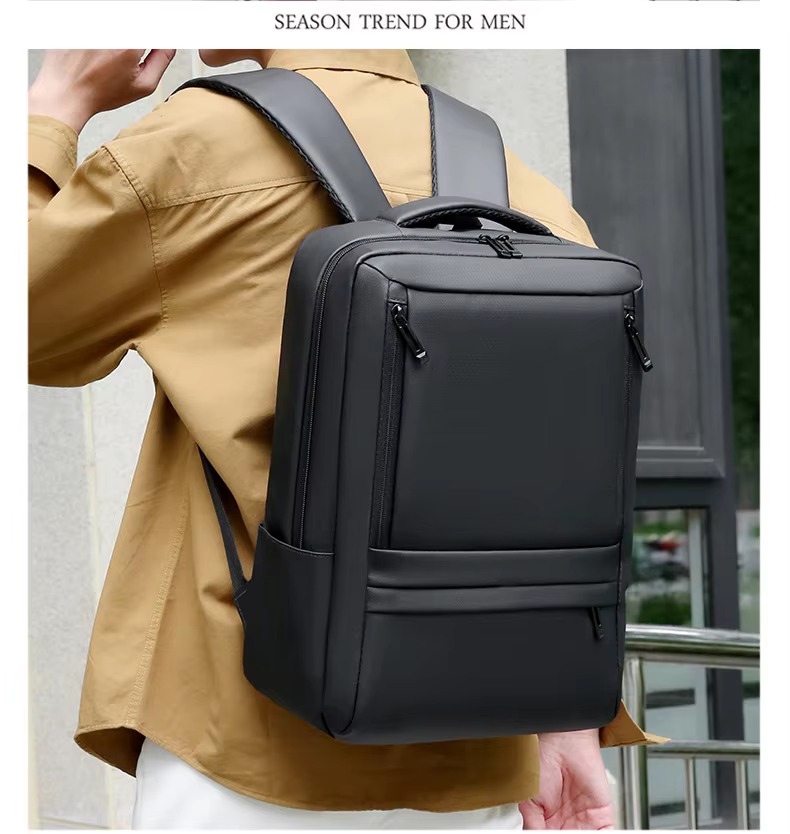 man wearing black backpack on both shoulders outdoors