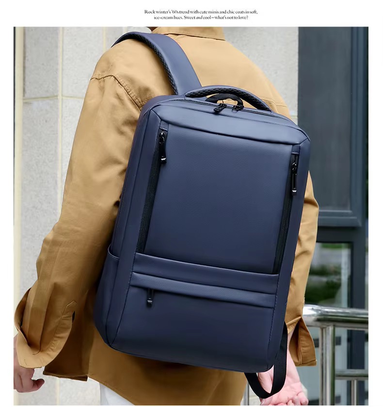 man wearing navy blue backpack outdoors