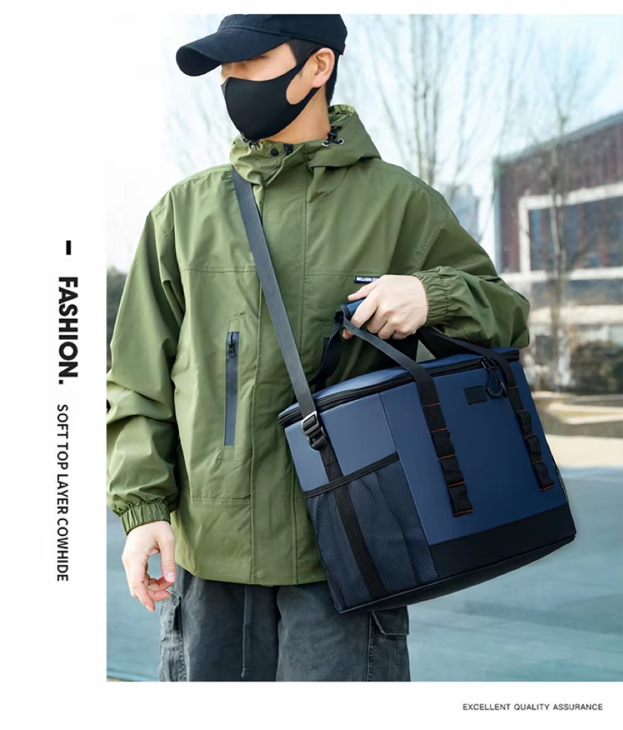 man carrying navy blue bag by top handle over shoulder