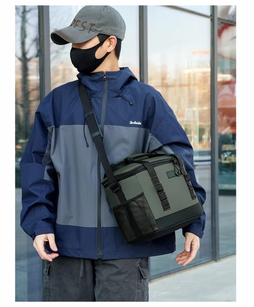 man wearing gray-green bag crossbody style from behind