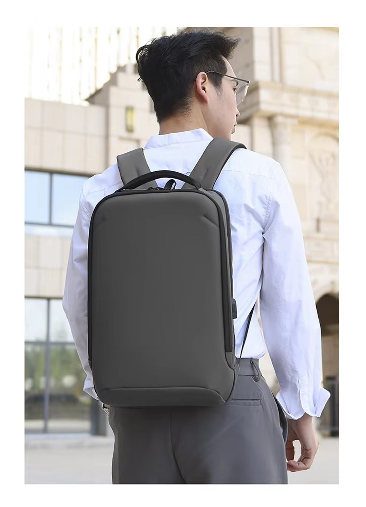 four-angle display of black backpack -- front, side, and back views