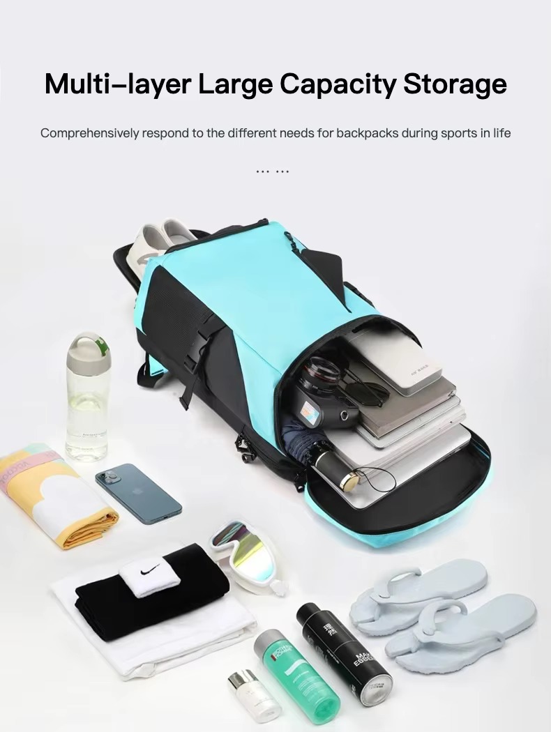 open backpack packed with laptop, camera, umbrella, and shoes below