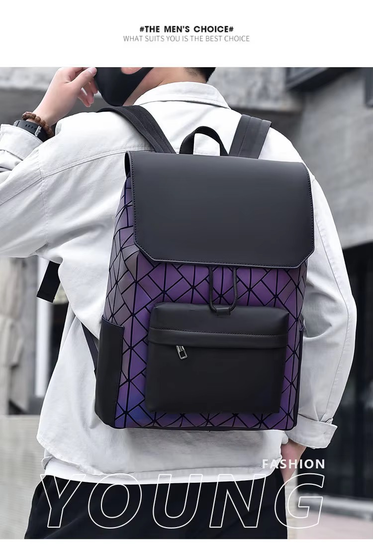 model wearing the purple reflective colorway backpack, viewed from behind