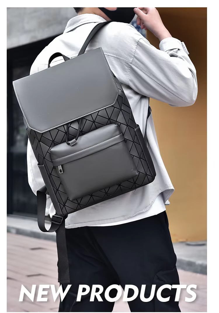 gray backpack carried as a handheld bag and worn as a backpack