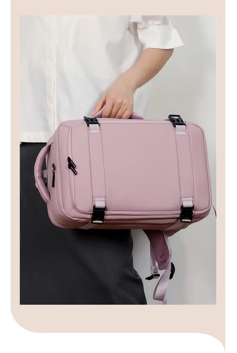 pink backpack carried by top handle