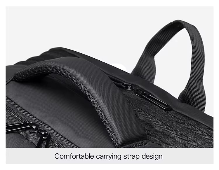 side view of black backpack showing compression straps and side handle