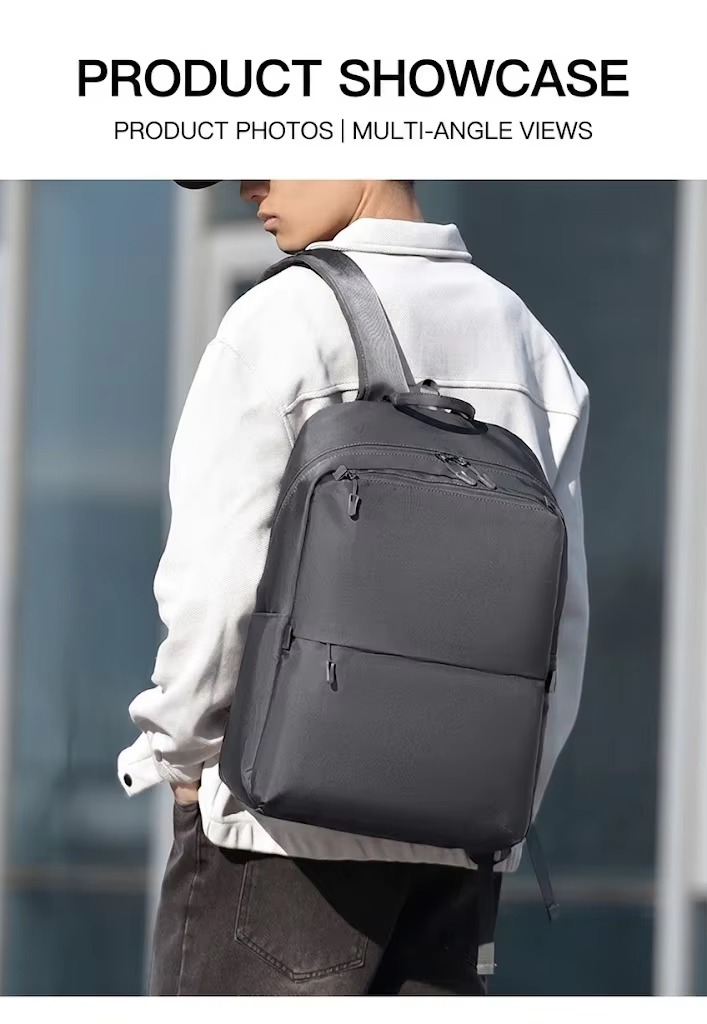 man wearing gray backpack on both shoulders from behind