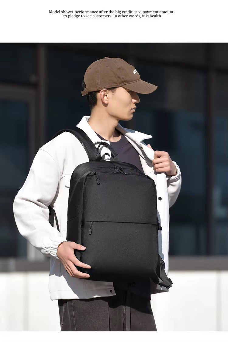 man wearing black backpack outdoors with hand adjusting cap