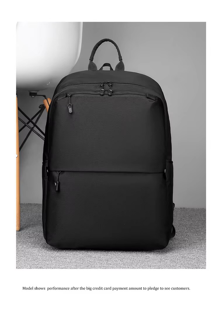 black backpack front view standing beside a chair