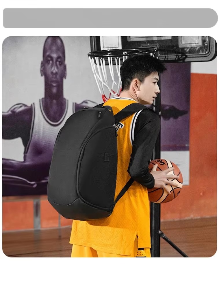 man wearing black backpack near basketball hoop
