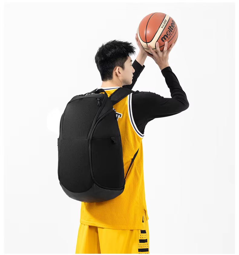 man shooting basketball while wearing black backpack