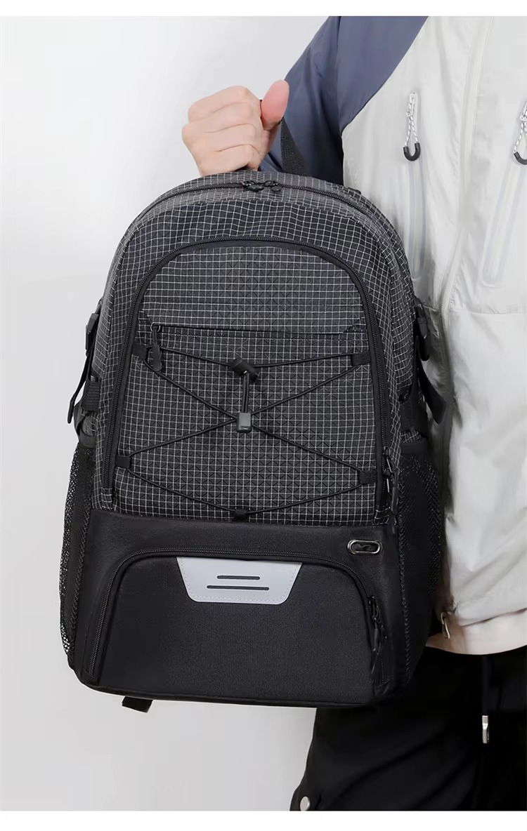 man dribbling a basketball while wearing the backpack