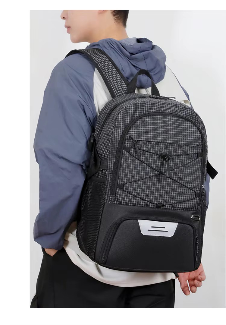 man walking on a basketball court wearing the backpack