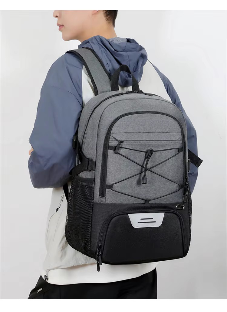 man wearing the backpack on campus stairs
