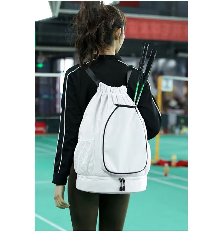player wearing white backpack with rackets on court