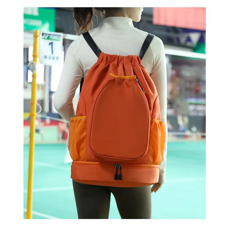 model wearing orange backpack