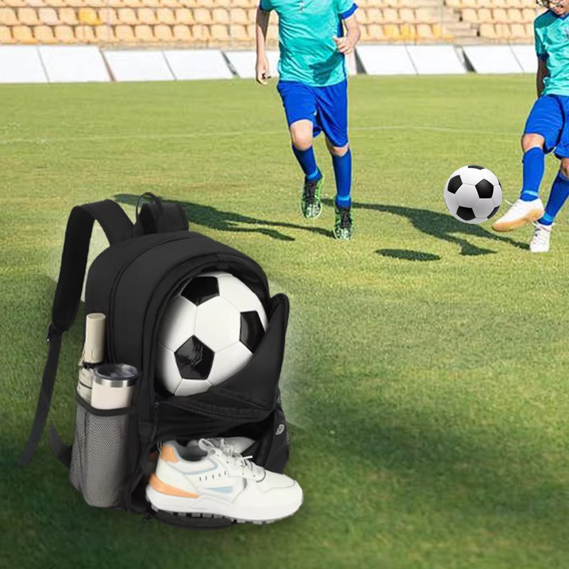 soccer backpack on field with ball and shoes