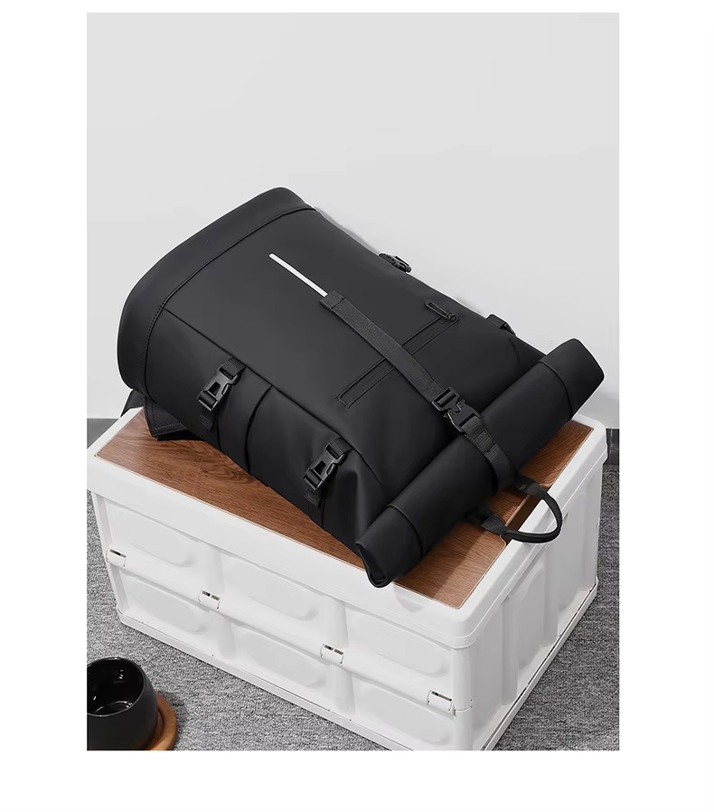 black backpack lying on storage box