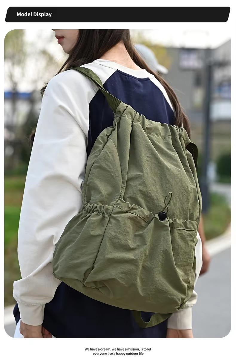 woman wearing green backpack side view