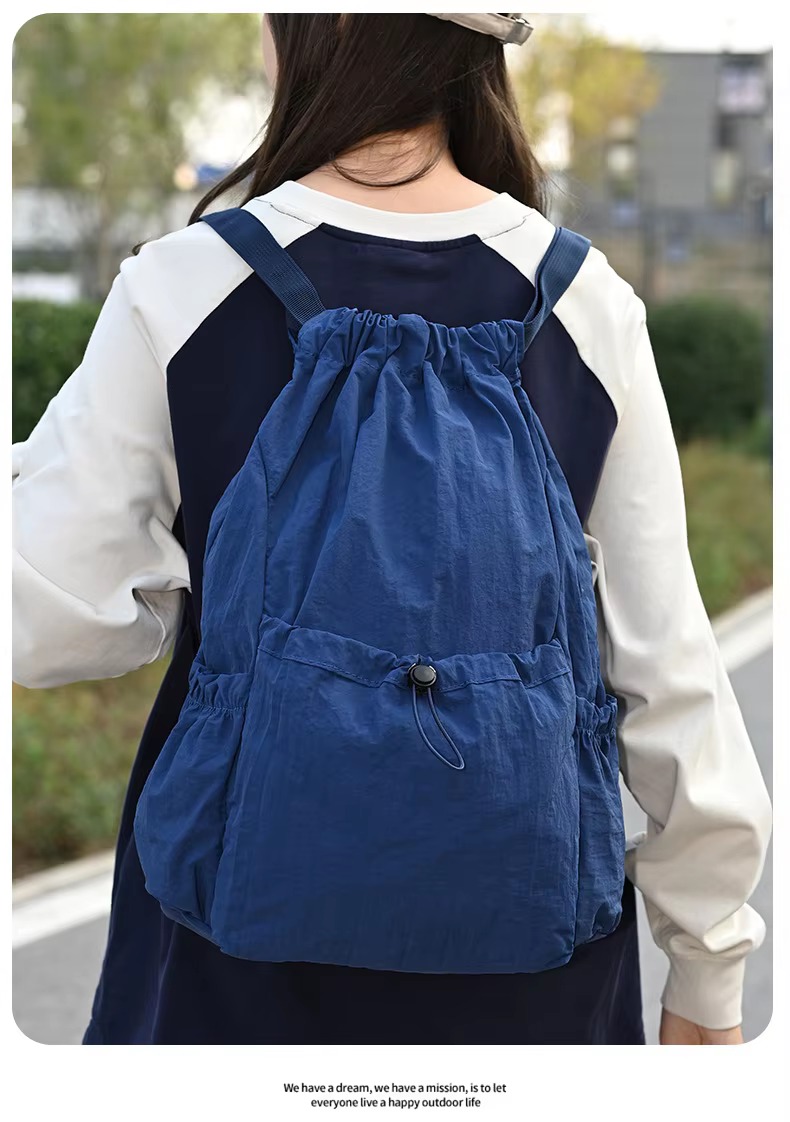 woman wearing blue backpack