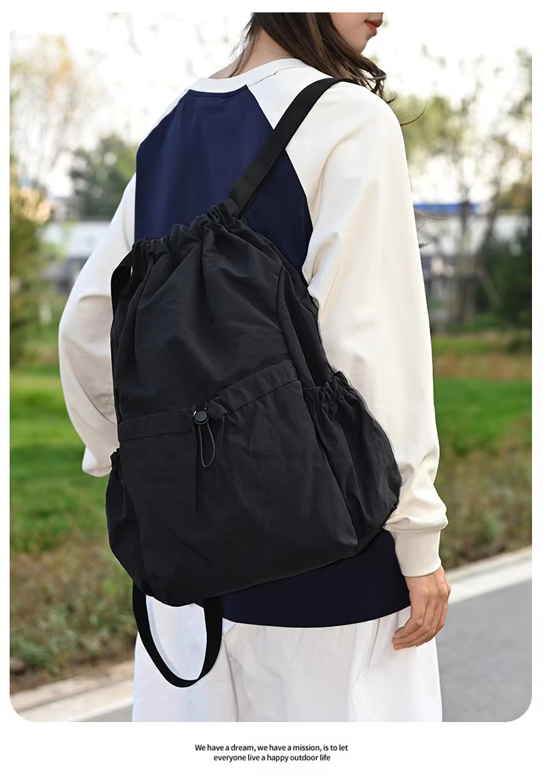 woman wearing black backpack