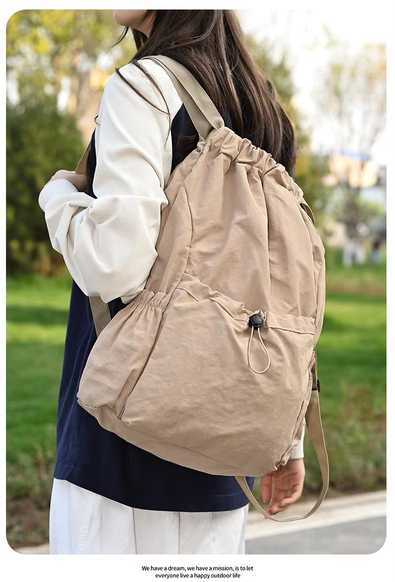 beige backpack side angle