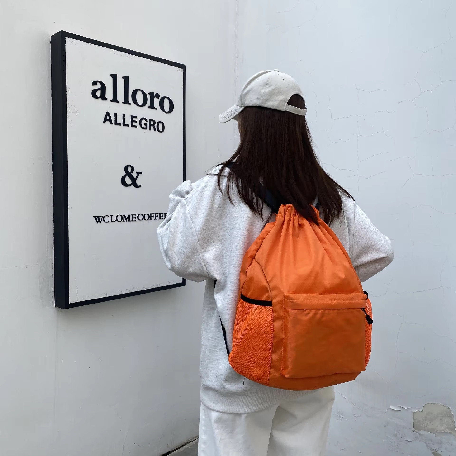 orange backpack rear angle