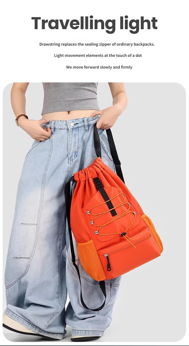 woman holding orange backpack