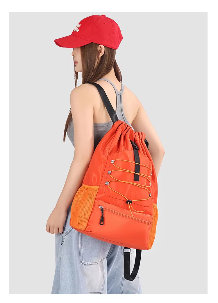 woman wearing orange backpack
