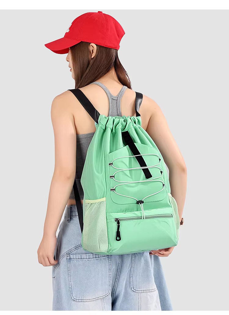 woman wearing green backpack