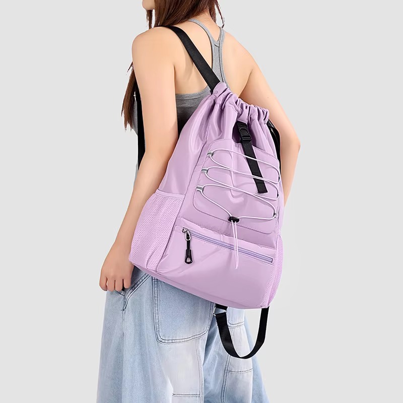 woman wearing purple backpack