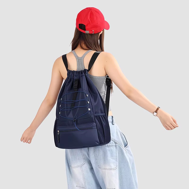 woman wearing dark blue backpack
