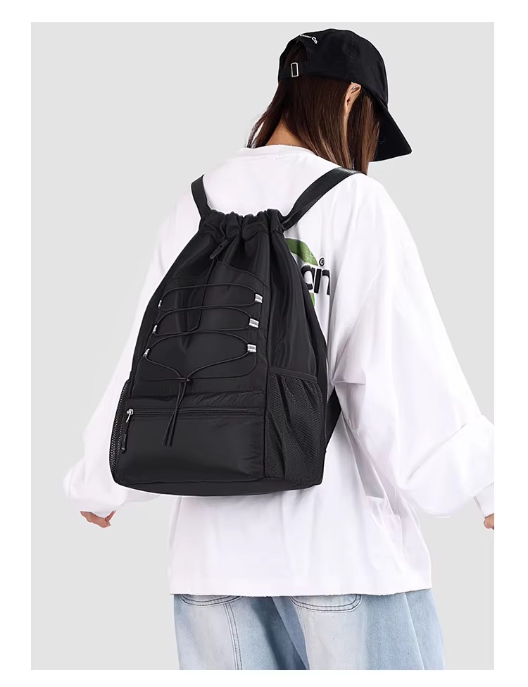 woman wearing black backpack