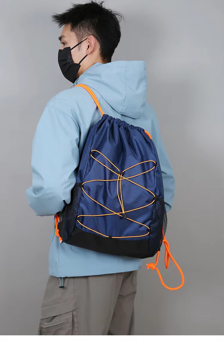man wearing navy blue backpack