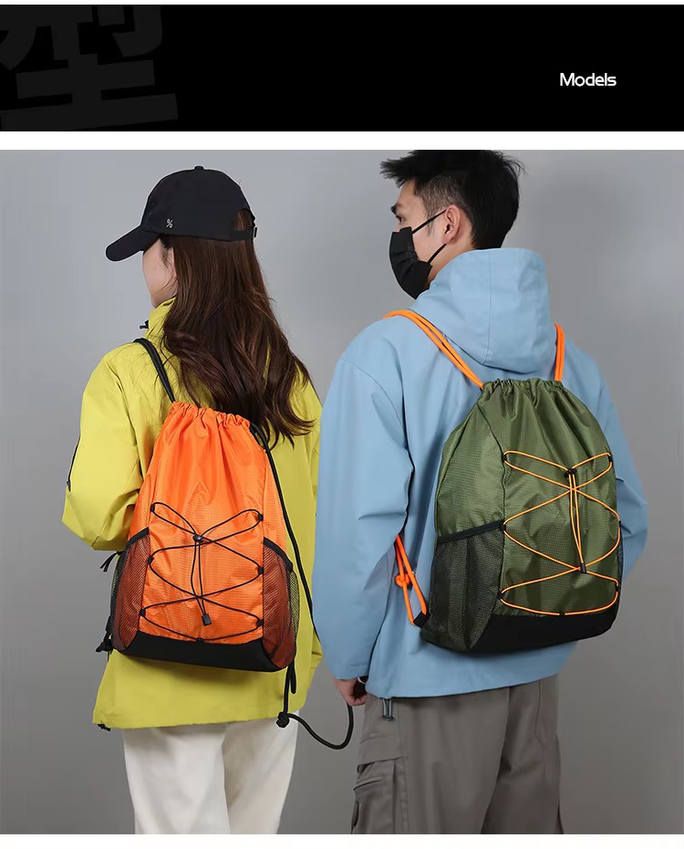 couple wearing orange and army green backpacks