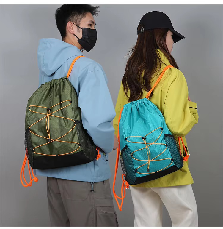 couple with army green and lake green backpacks