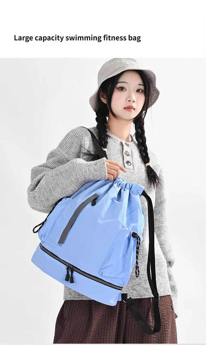 woman holding blue swimming fitness backpack
