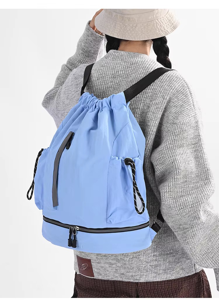 woman wearing blue backpack
