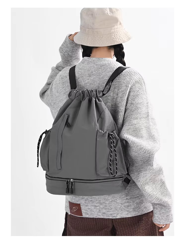 woman wearing gray backpack
