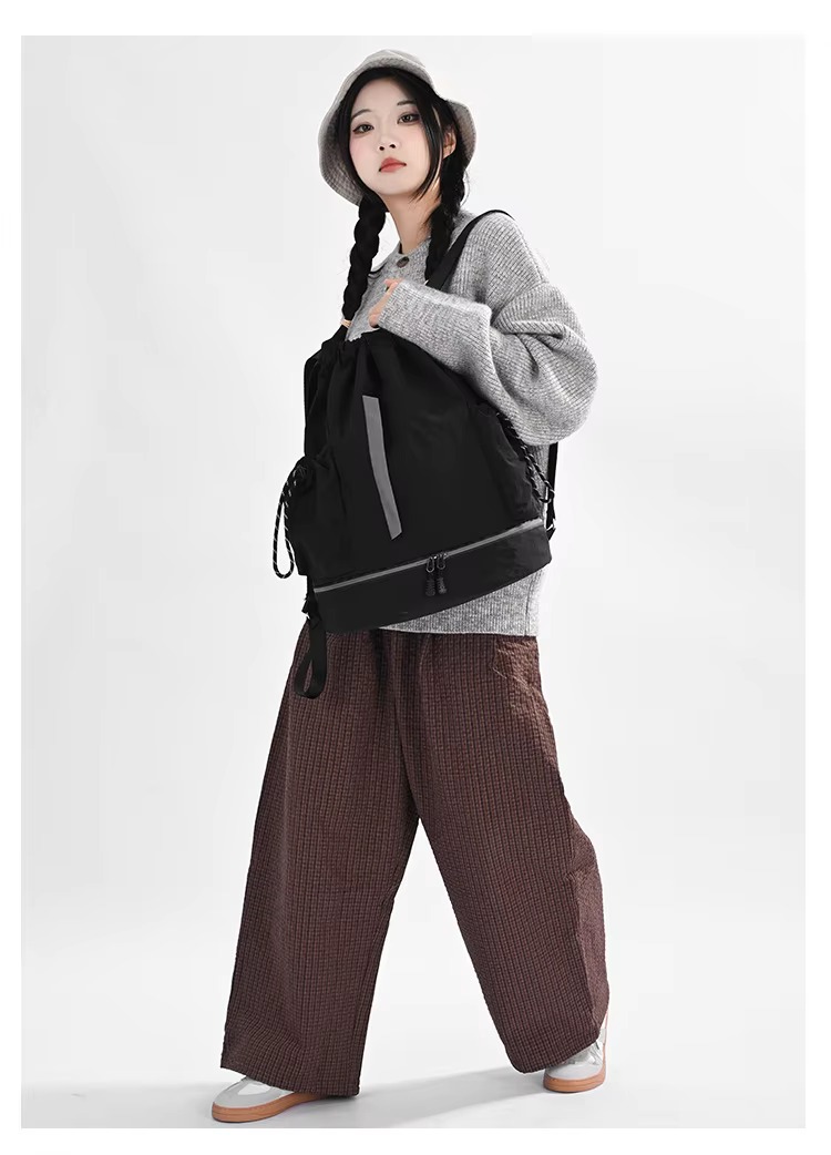 woman wearing black backpack full length