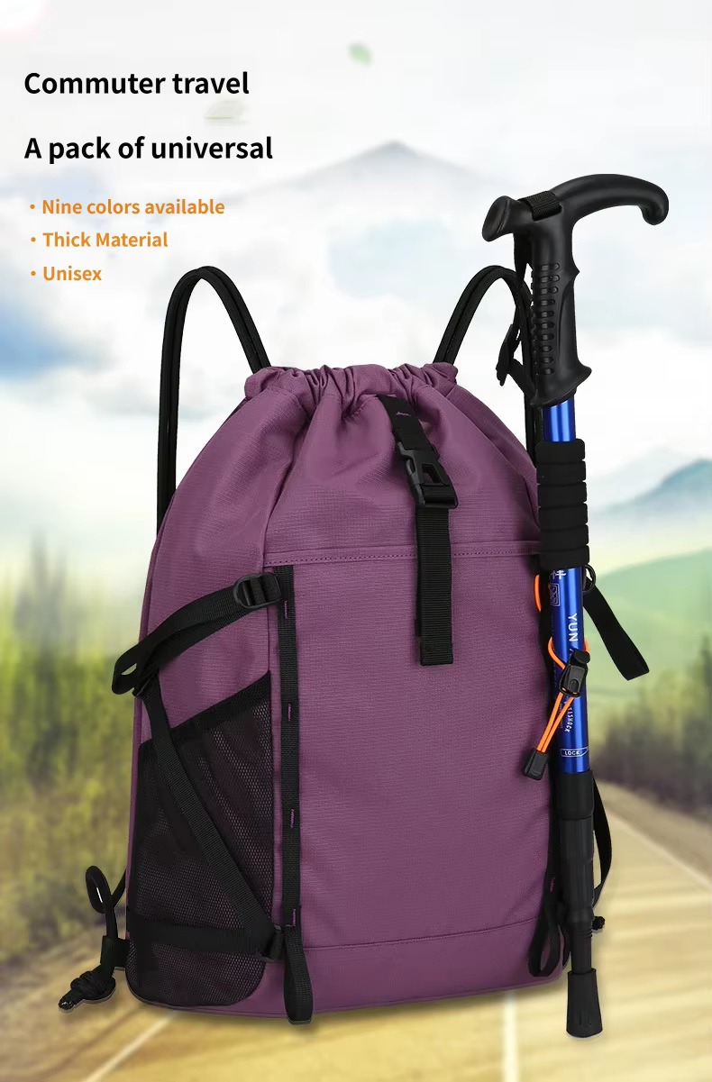 purple drawstring backpack with trekking pole attached